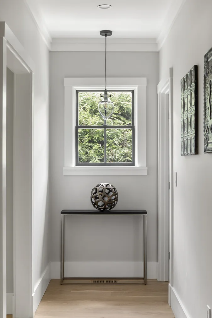 hallway with accent furniture and pendant 