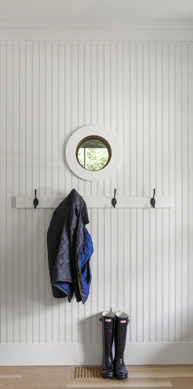 mudroom with wood tough and groove walls