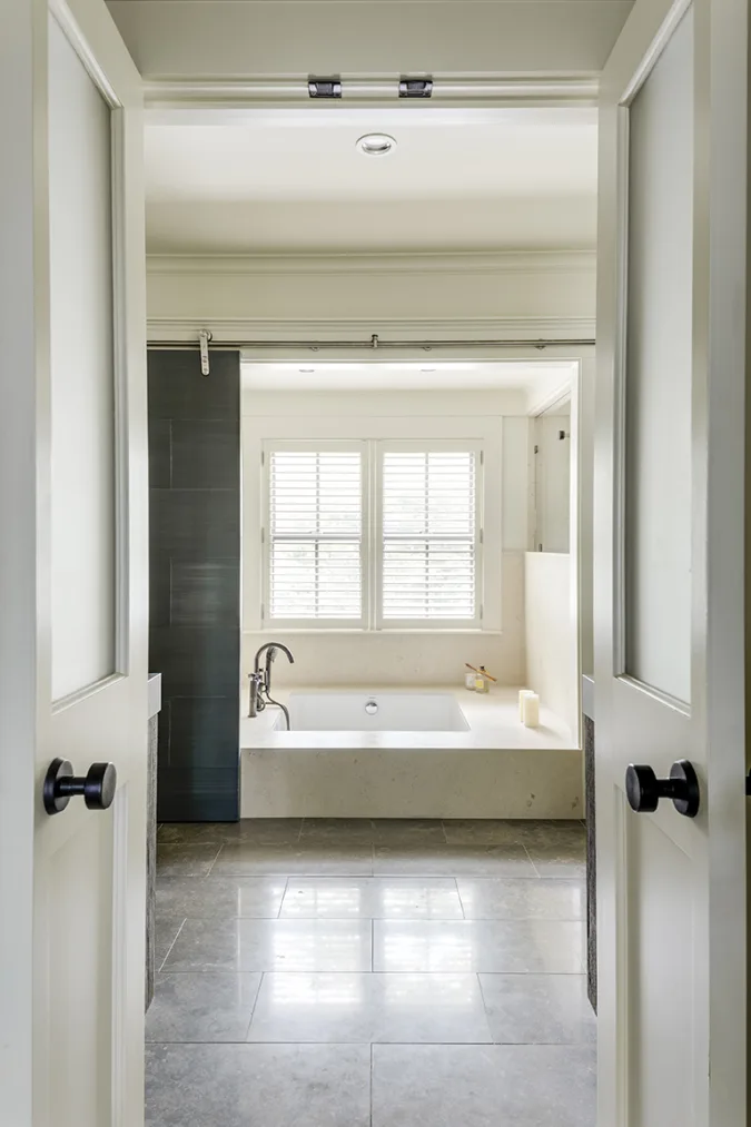 master bath with zinc barn door