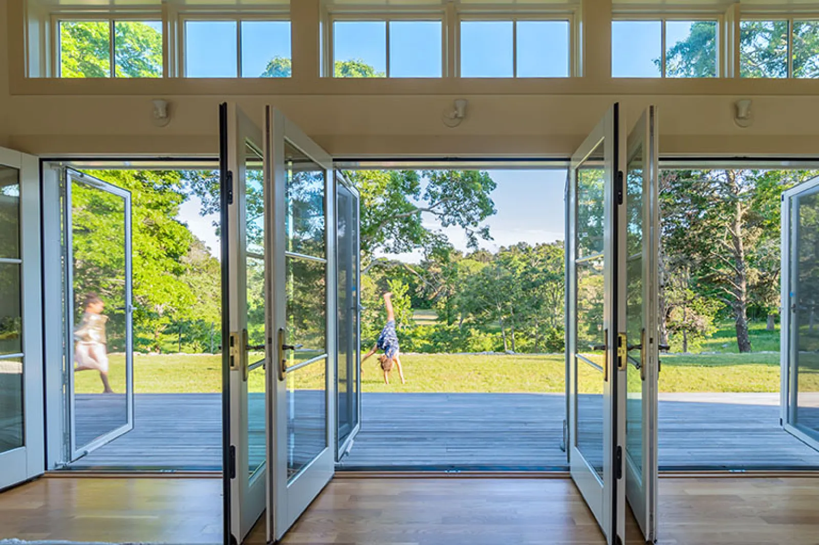 open living room doors with views to a pond