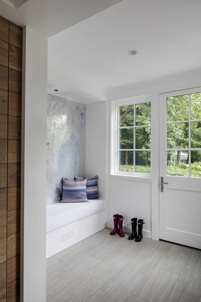 mudroom with large cushioned bench