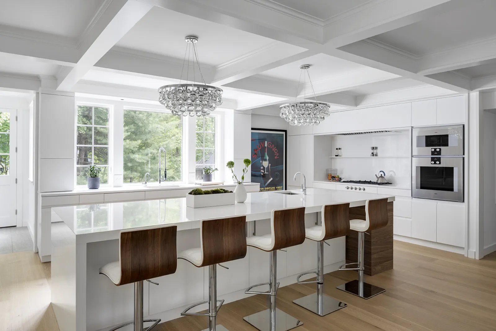 transitional kitchen with large island and pendants